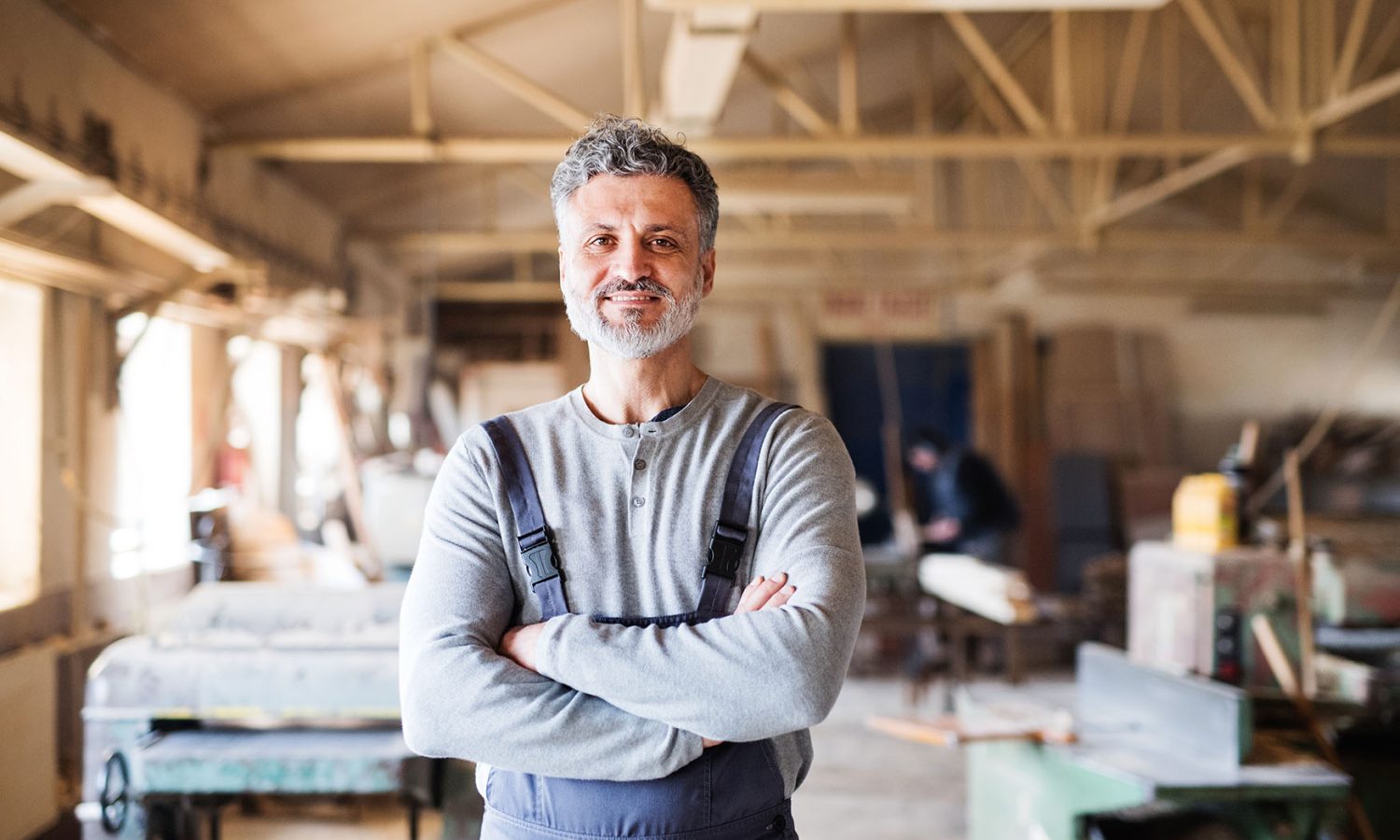 Portrait of a man worker in the carpentry workshop.