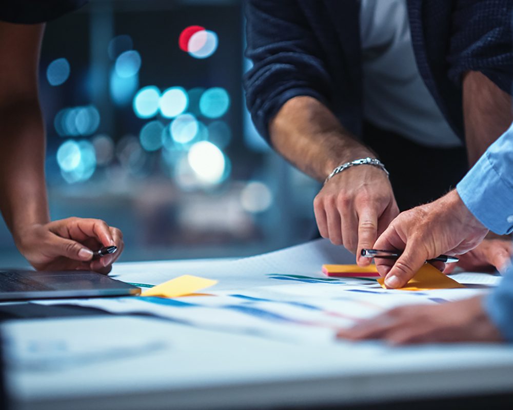 Office Conference Room Meeting: Diverse Team of Top Managers Talk, Brainstorm, Use Digital Tablet. Business Partners Discuss Financial Reports, Plan Investment Strategy. Team of Three