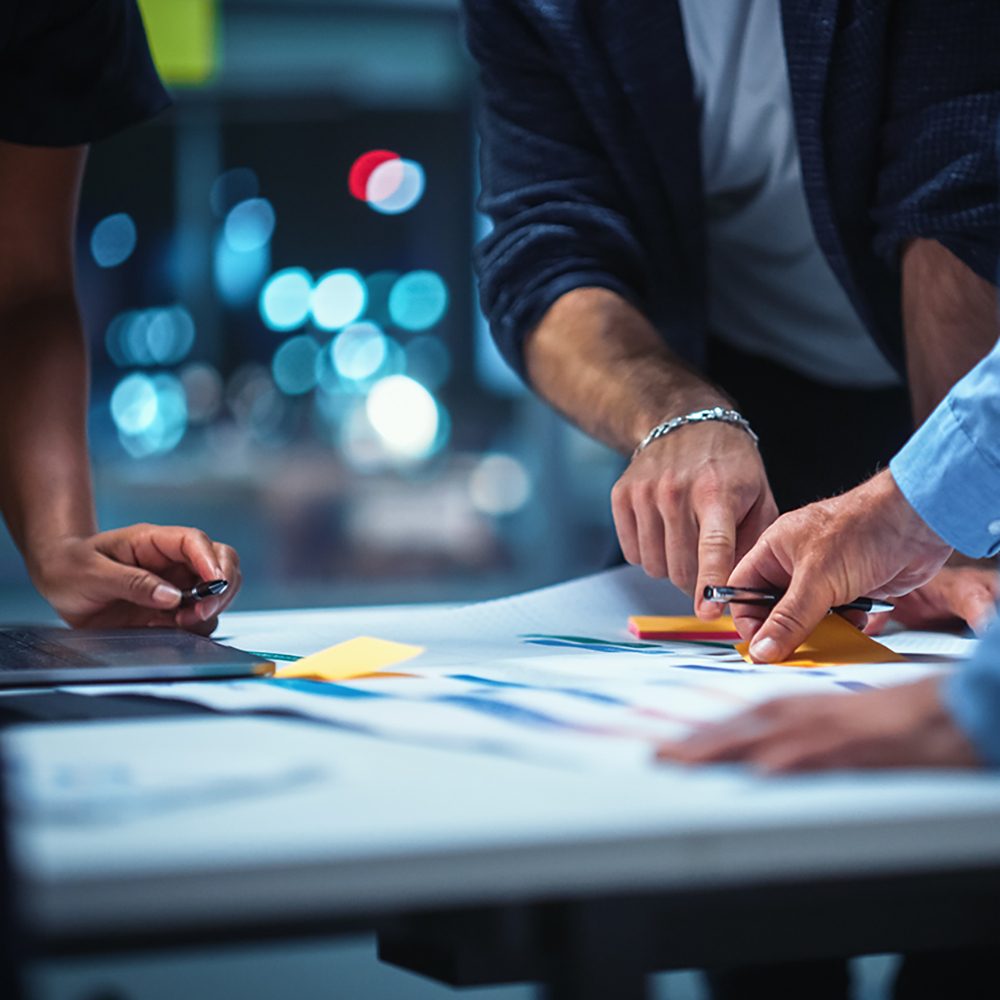 Office Conference Room Meeting: Diverse Team of Top Managers Talk, Brainstorm, Use Digital Tablet. Business Partners Discuss Financial Reports, Plan Investment Strategy. Team of Three